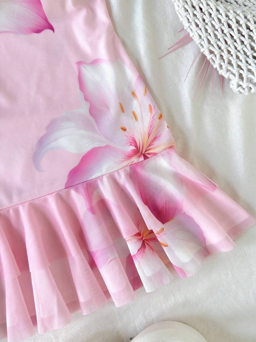 Pink sleeveless tween girls vacation cami dress with spaghetti straps, tiered layer detail, flounce ruffle hem, slim fit, and built-in shorts.