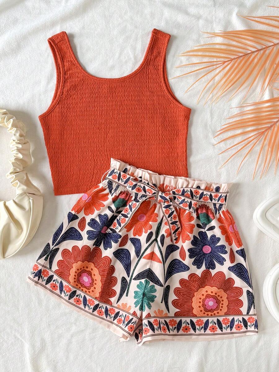 Tween girls 2-piece summer set featuring a turquoise blue ribbed tank top and tropical leaf pattern belted shorts.