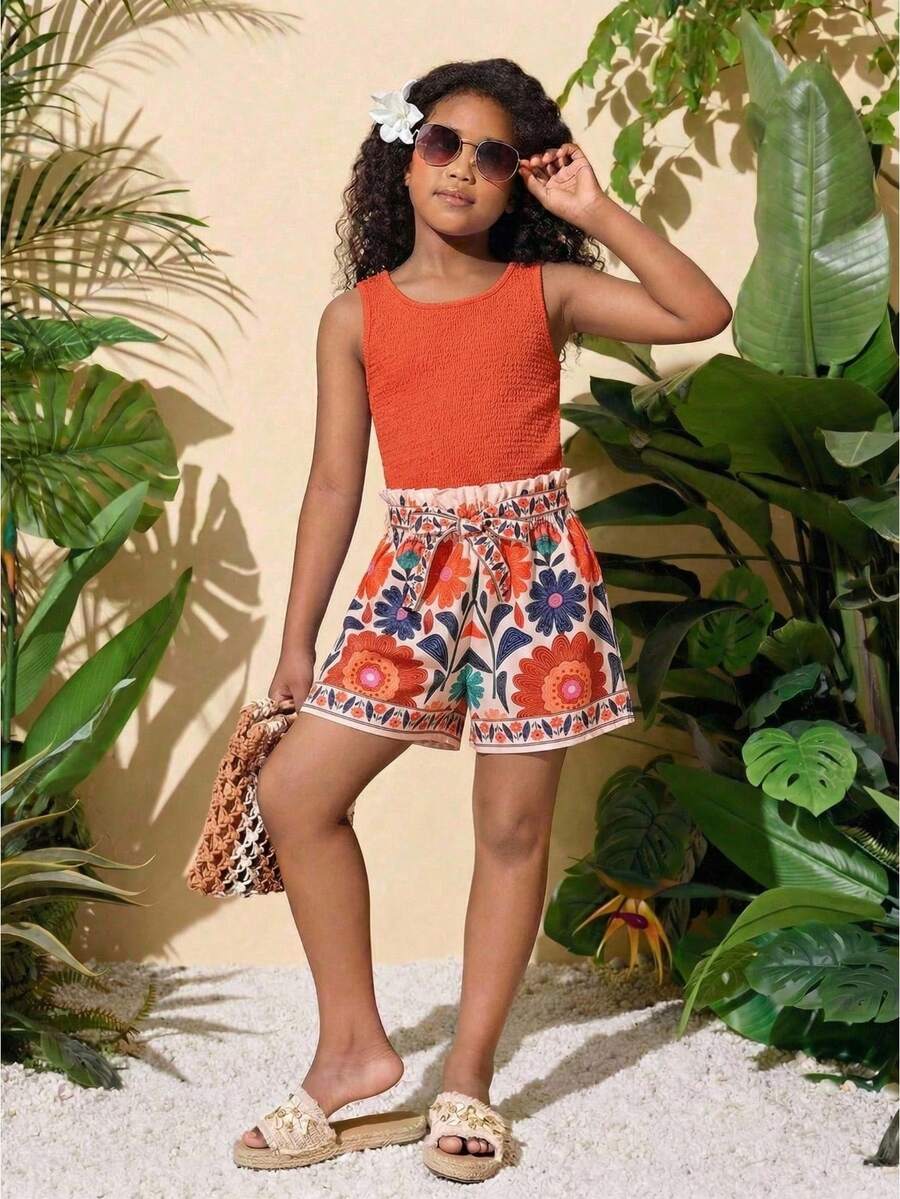 Tween girls 2-piece summer set featuring a turquoise blue ribbed tank top and tropical leaf pattern belted shorts.