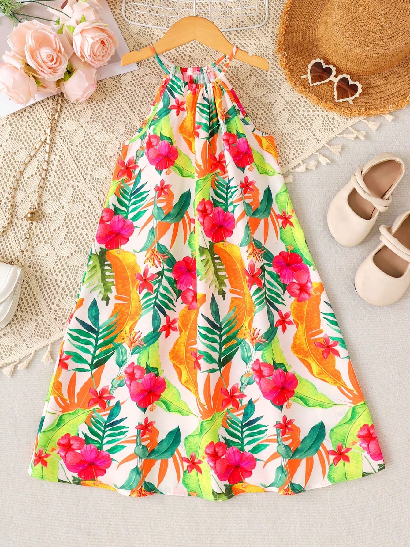 Tween girls sleeveless halter A-line dress with multicolor tropical fruit and vegetable all-over print, high waist, flounce hem, and zipper detail for summer vacation wear