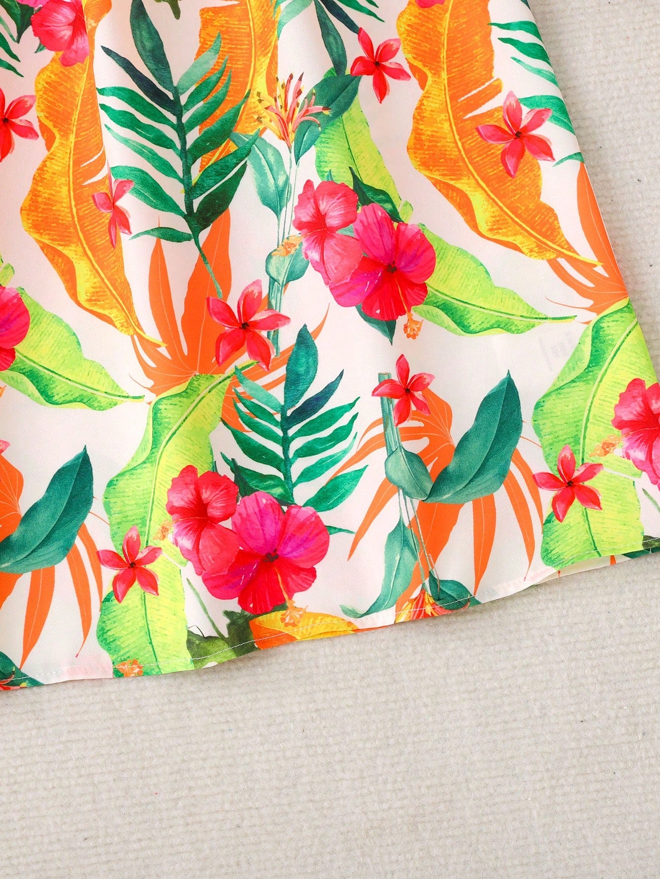 Tween girls sleeveless halter A-line dress with multicolor tropical fruit and vegetable all-over print, high waist, flounce hem, and zipper detail for summer vacation wear