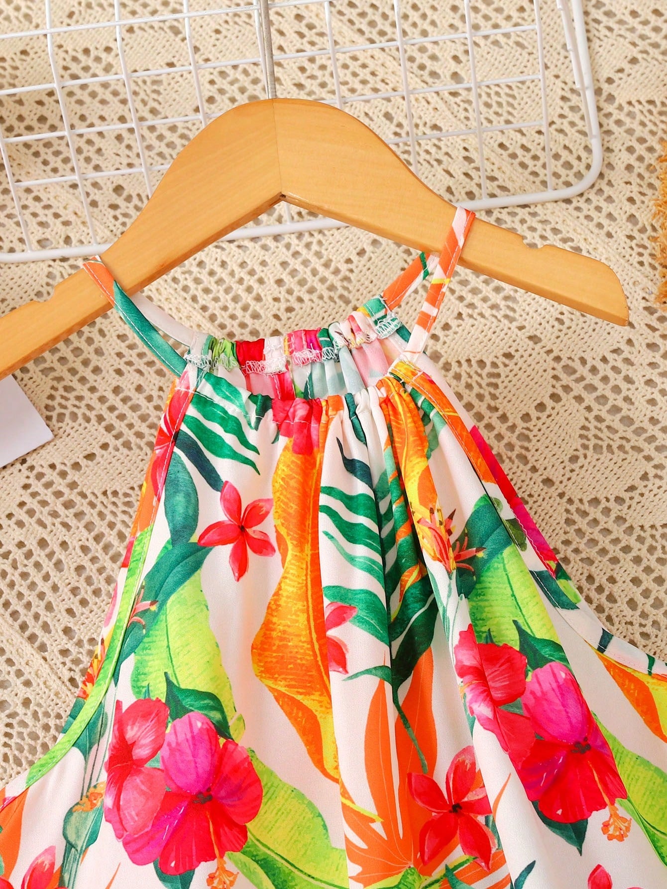 Tween girls sleeveless halter A-line dress with multicolor tropical fruit and vegetable all-over print, high waist, flounce hem, and zipper detail for summer vacation wear
