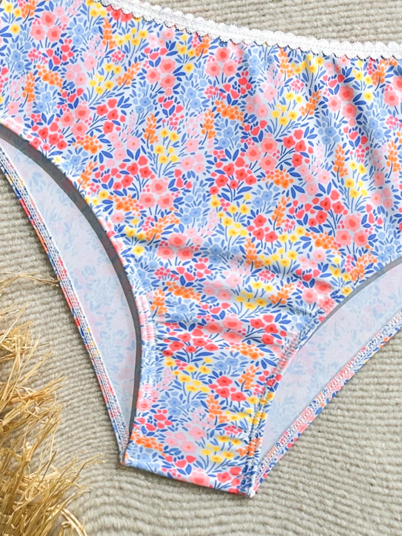 Tween girls 2-piece ditsy floral bikini set featuring a spaghetti strap top with center string detail and matching bottoms with side strings, designed for swimming, vacation, and summer wear.