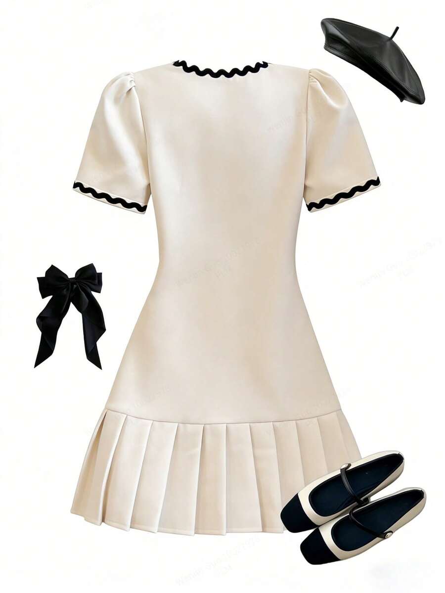 Tween girls apricot short-sleeve pleated smock dress with 3D bow decor and round neckline.