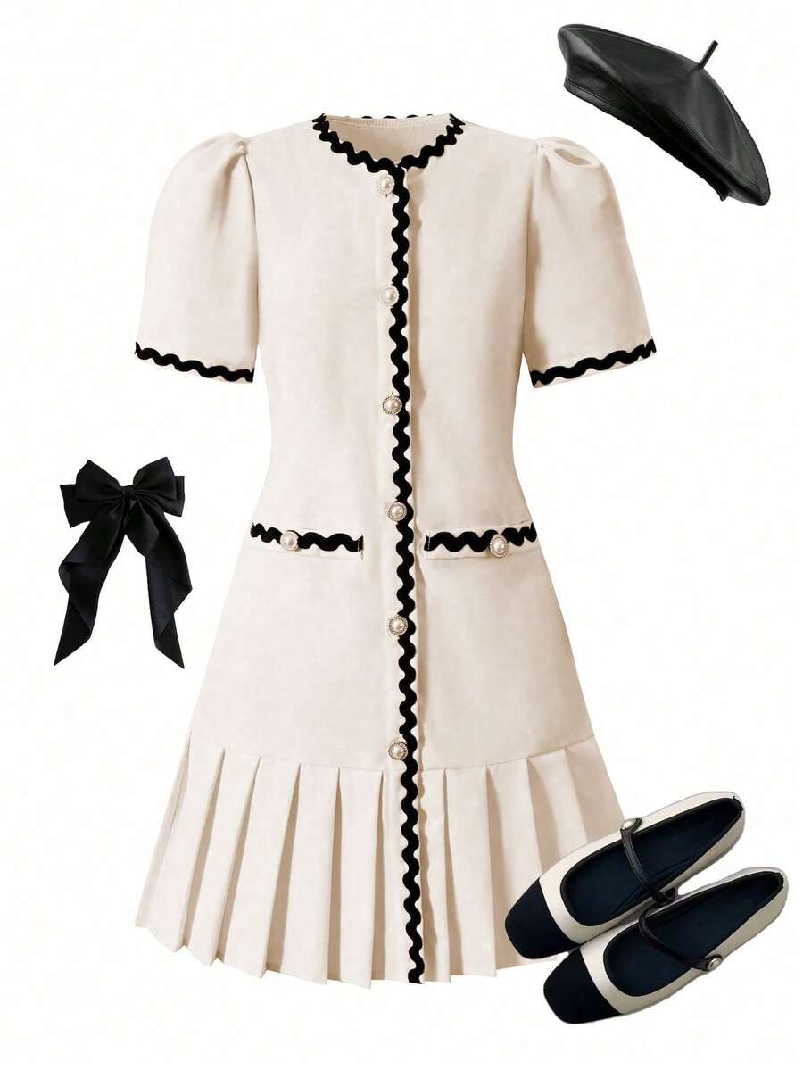 Tween girls apricot short-sleeve pleated smock dress with 3D bow decor and round neckline.