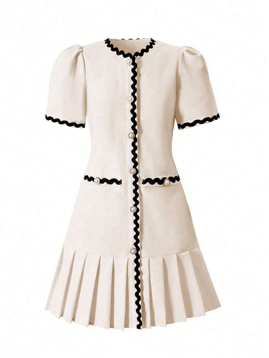 Tween girls apricot short-sleeve pleated smock dress with 3D bow decor and round neckline.