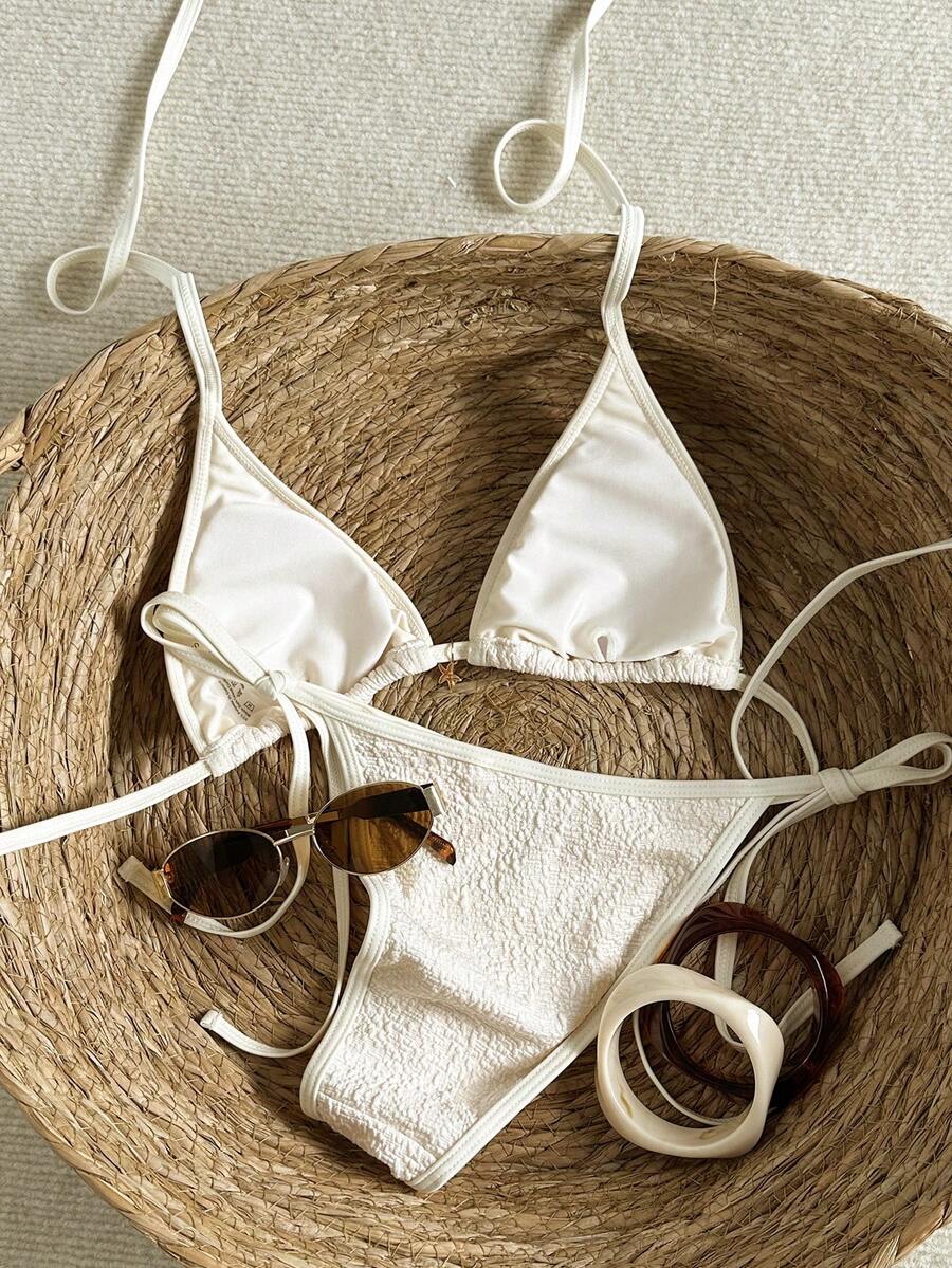 Women's apricot solid halter tie bikini top with triangle cups and matching tie-side swimsuit bottoms.