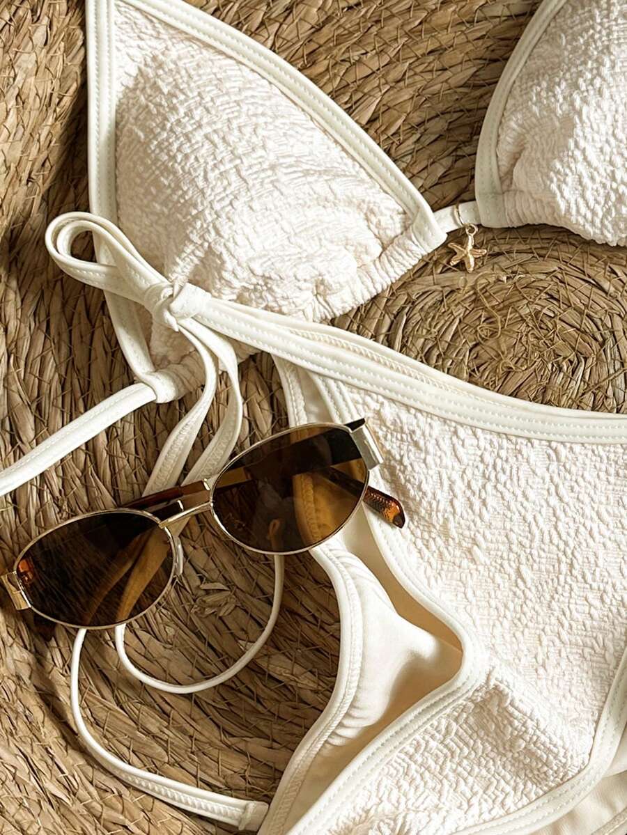 Women's apricot solid halter tie bikini top with triangle cups and matching tie-side swimsuit bottoms.