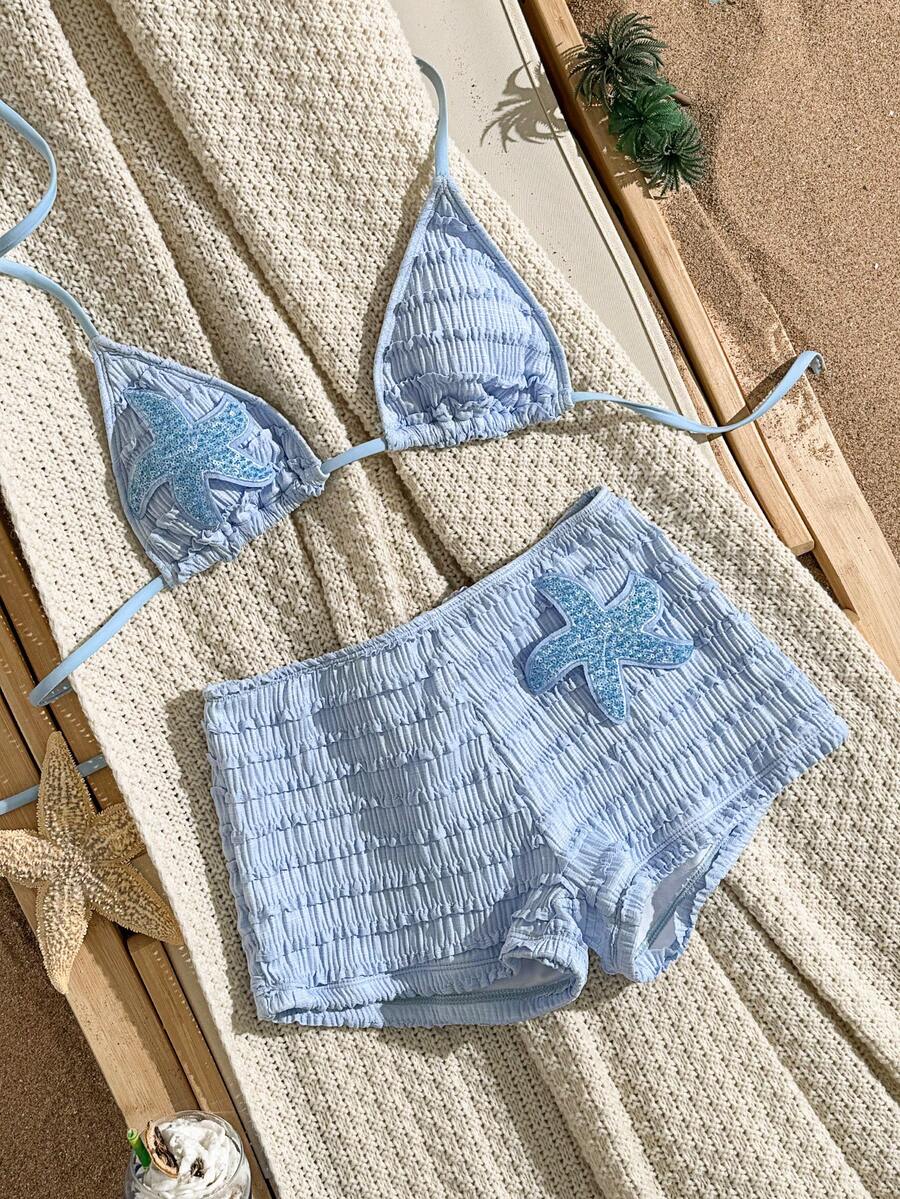 Women's apricot two-piece swimsuit set with a halter tie-back top and matching high stretch shorts.