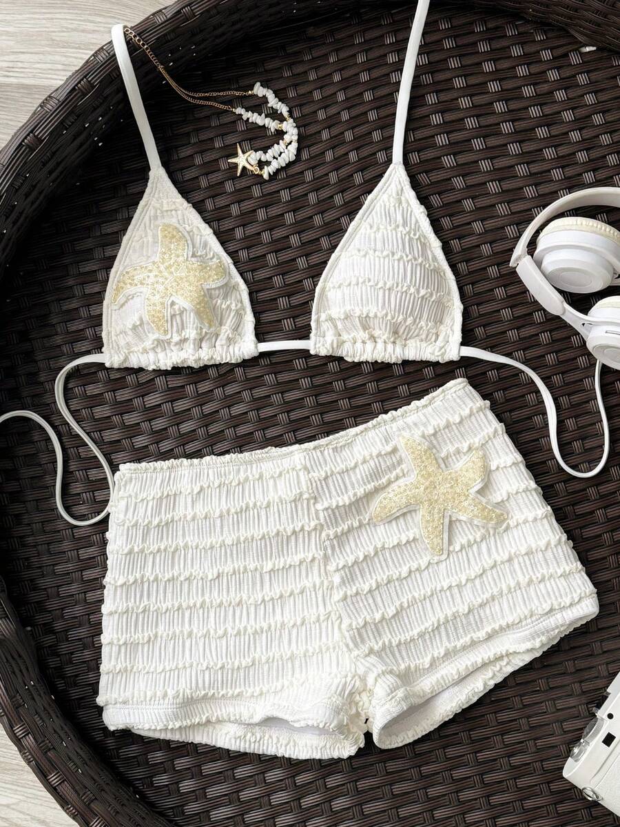 Women's apricot two-piece swimsuit set with a halter tie-back top and matching high stretch shorts.