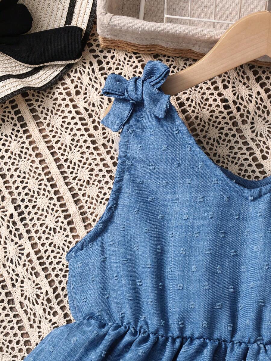 Girls sleeveless blue tiered dress featuring a V-neckline, high waist, and A-line skirt.