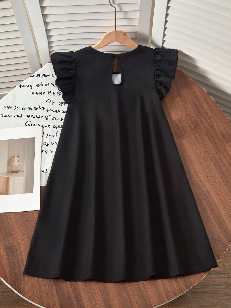 Tween girls sleeveless tropical floral mini dress in black with round neck and ruffle hem detail