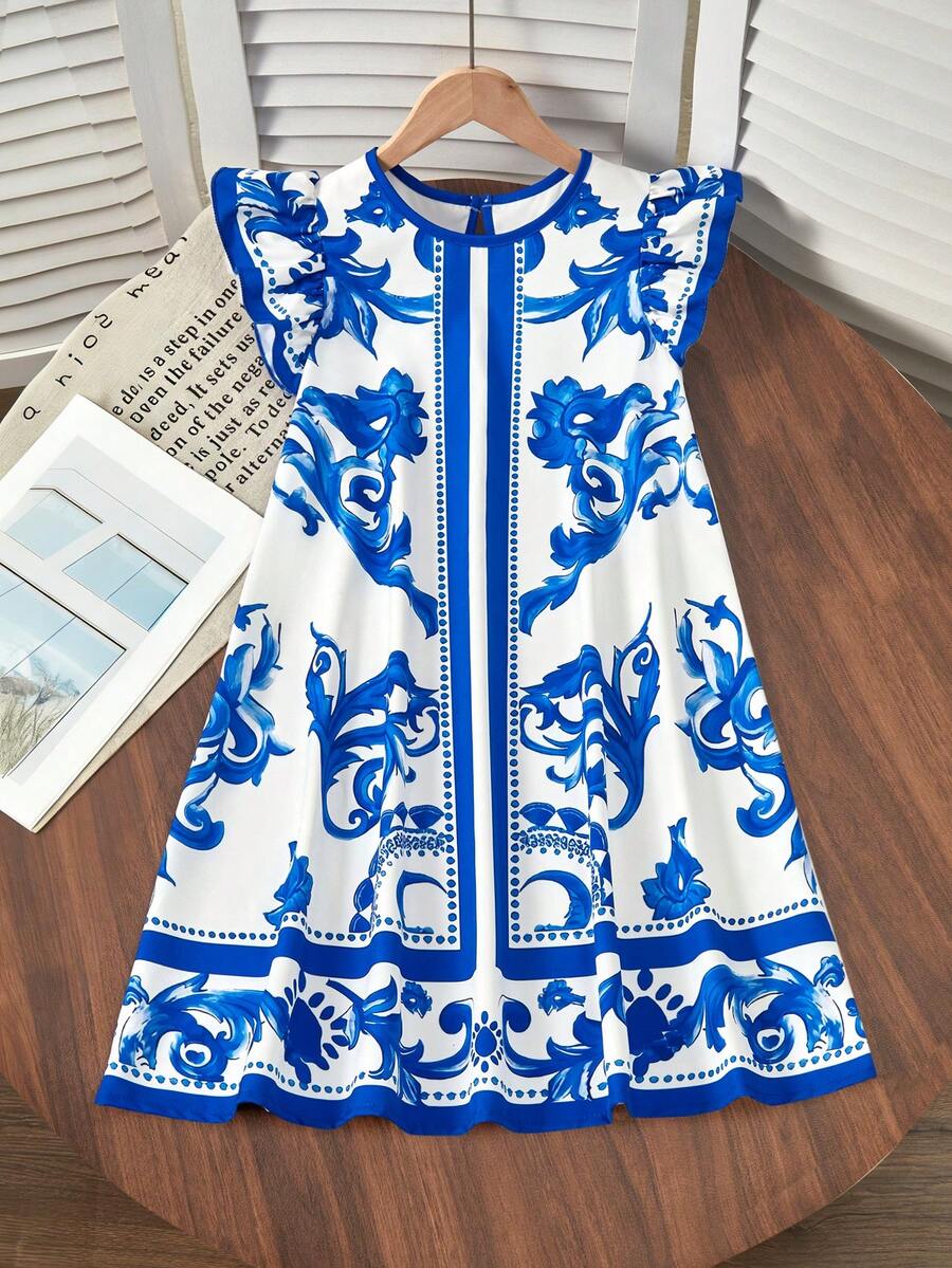 Tween girls sleeveless tropical floral mini dress in black with round neck and ruffle hem detail
