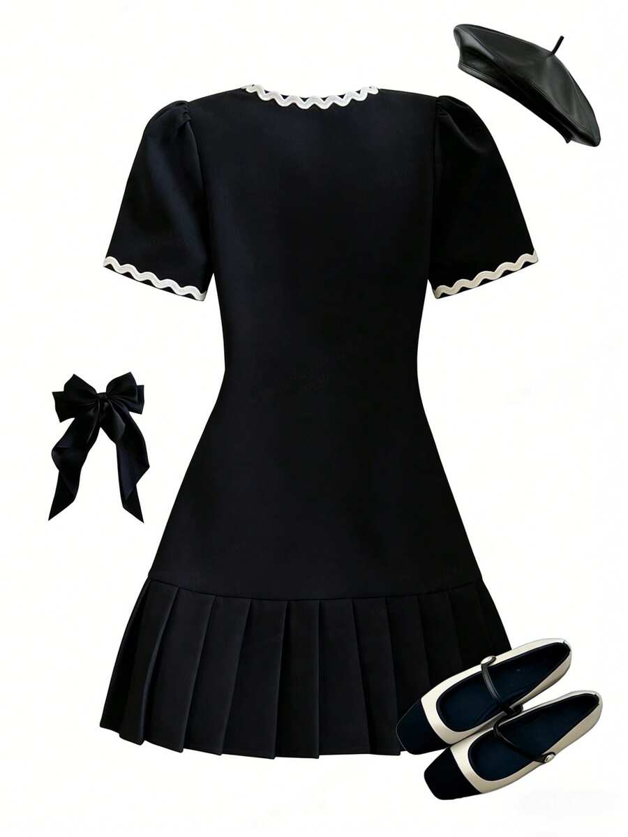 Tween girls apricot short-sleeve pleated smock dress with 3D bow decor and round neckline.