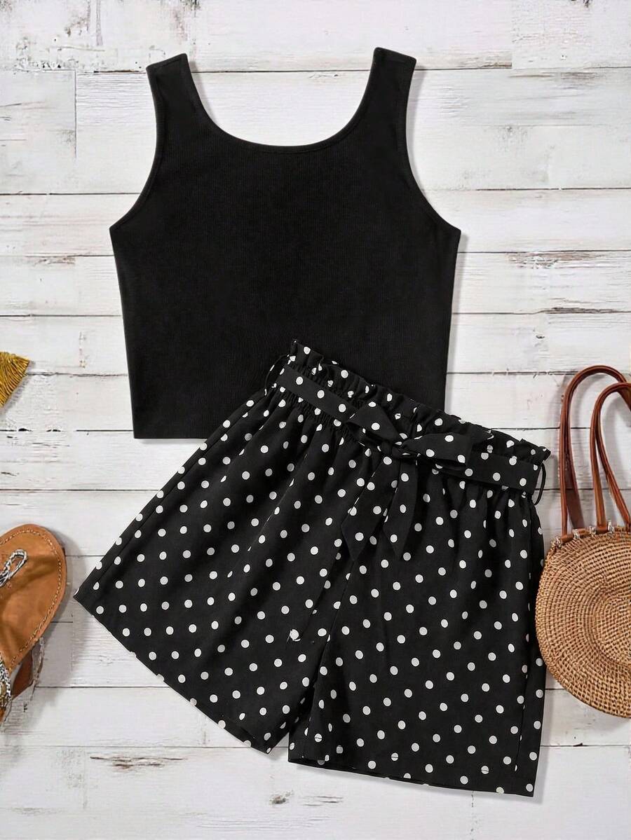 Tween girl wearing a casual 2-piece set featuring a black rib-knit scoop neck tank top and leopard print paperbag waist shorts with a matching belt.