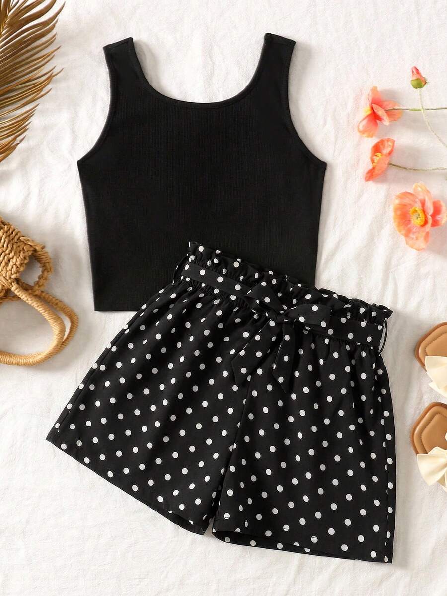 Tween girl wearing a casual 2-piece set featuring a black rib-knit scoop neck tank top and leopard print paperbag waist shorts with a matching belt.