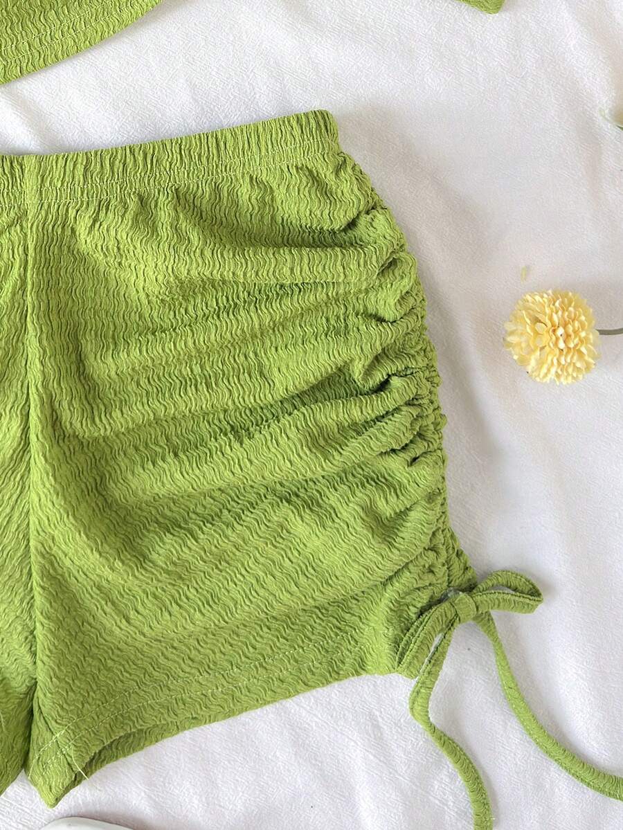 Tween girls army green striped rib-knit two-piece set with asymmetrical neck crop top and matching slim fit shorts.
