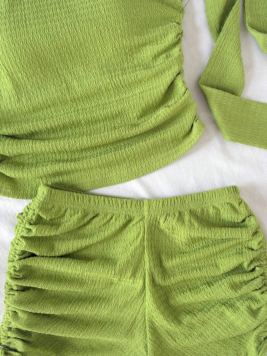 Tween girls army green striped rib-knit two-piece set with asymmetrical neck crop top and matching slim fit shorts.