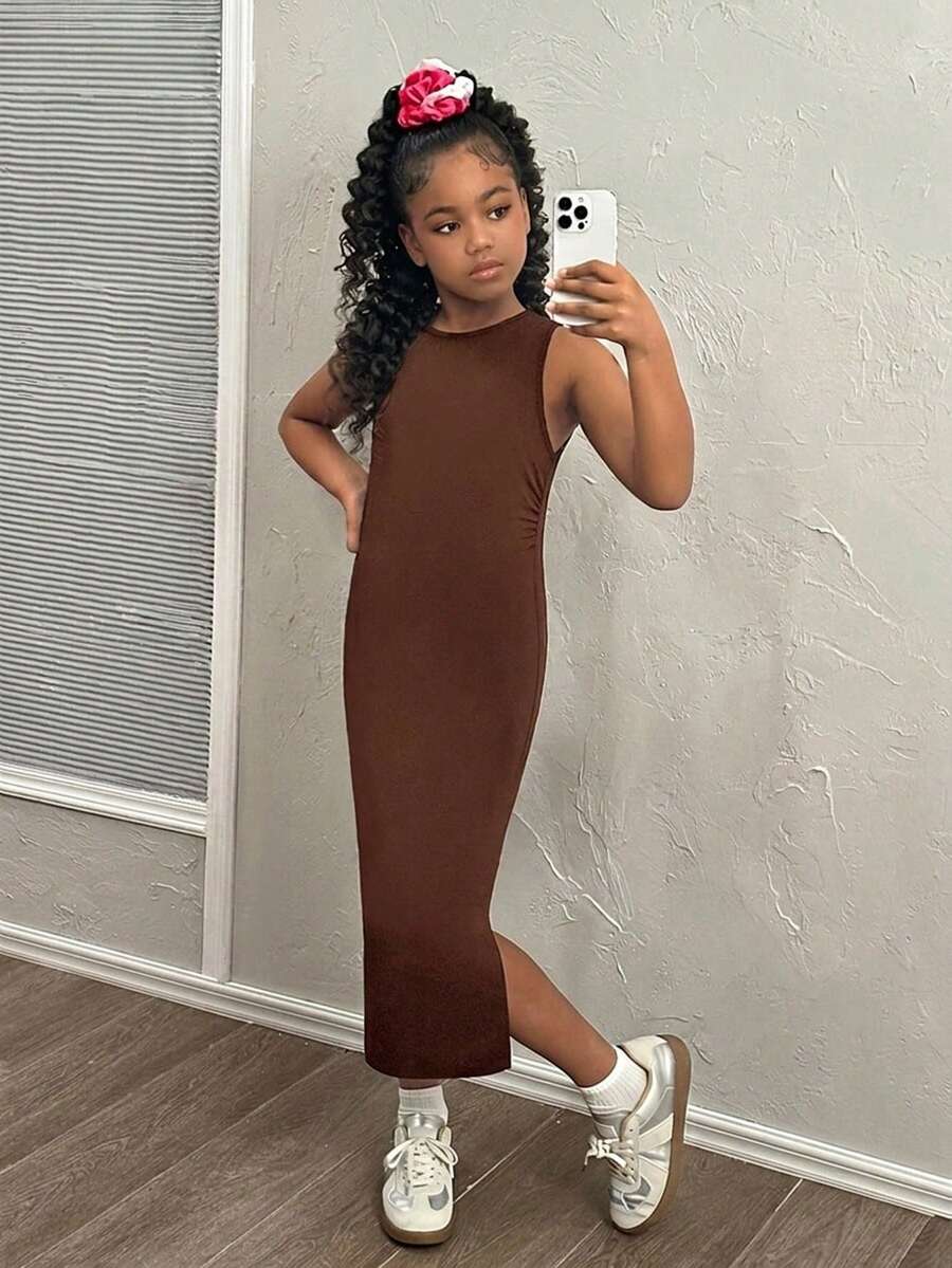 Tween girls sleeveless midi tank dress with round neck, graphic pattern, slim fit waist, slit hem, and apricot color styling for casual and occasion wear.