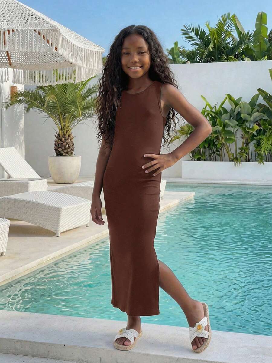 Tween girls sleeveless midi tank dress with round neck, graphic pattern, slim fit waist, slit hem, and apricot color styling for casual and occasion wear.