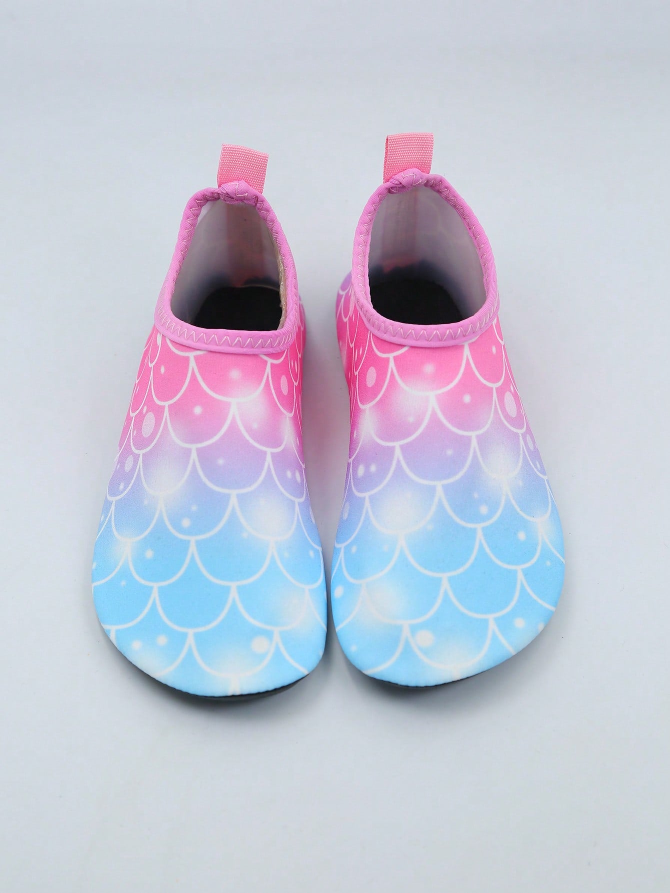 Multicolor kids slip-on water shoes with breathable Lycra upper and non-slip TPR outsole for boys and girls.