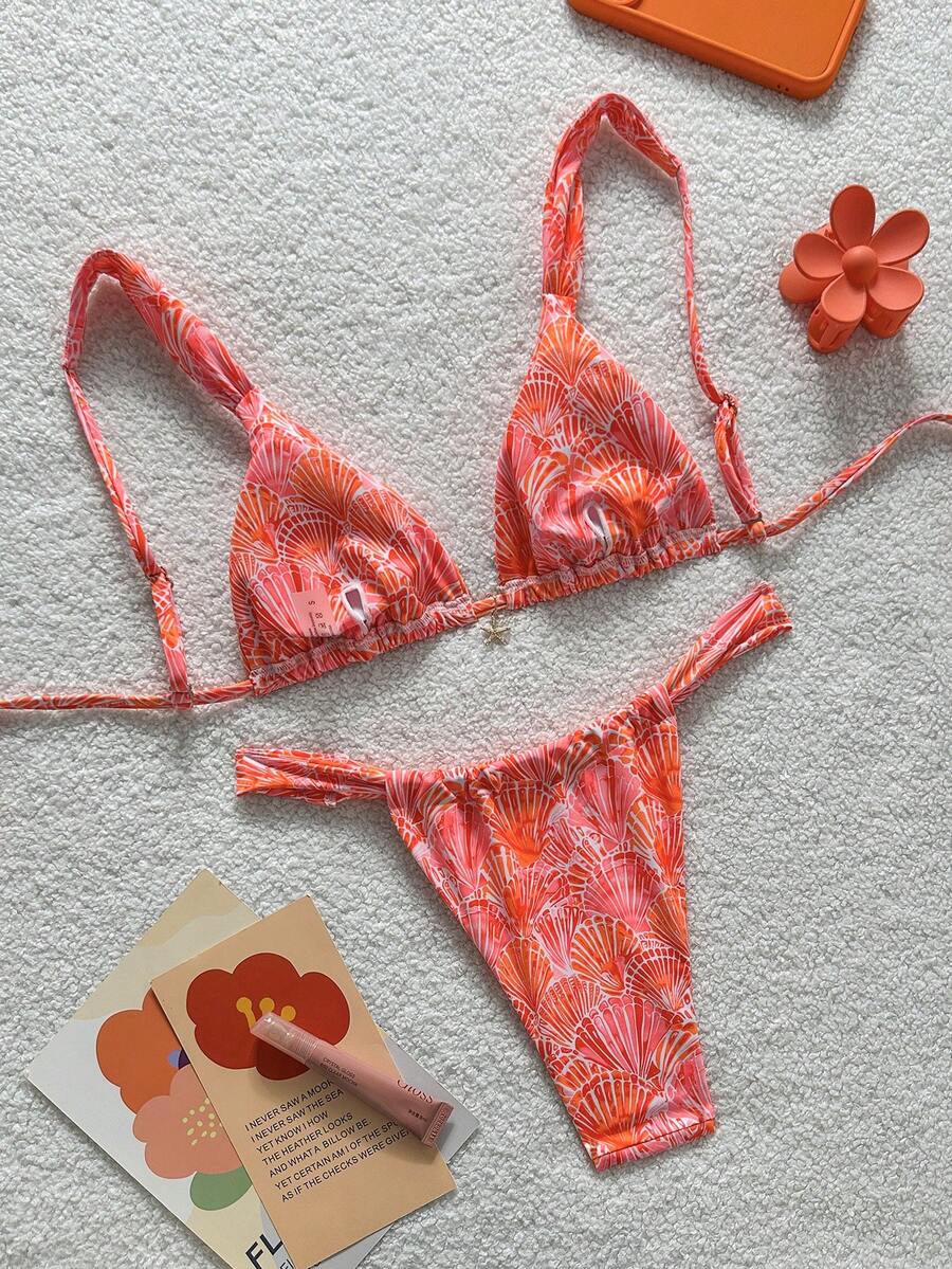 Women's 2-piece triangle cup bikini set in solid color featuring woven pearl shell decoration, halter neckline, and high-waist side-tie ruched bottoms.