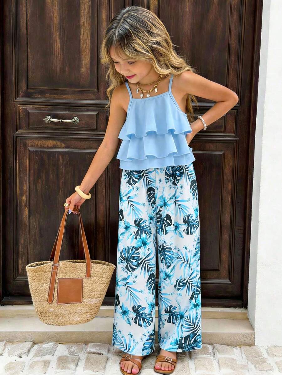 Tween girls blue 2-piece vacation outfit set featuring a tiered ruffle spaghetti strap camisole and loose high-waist pants.