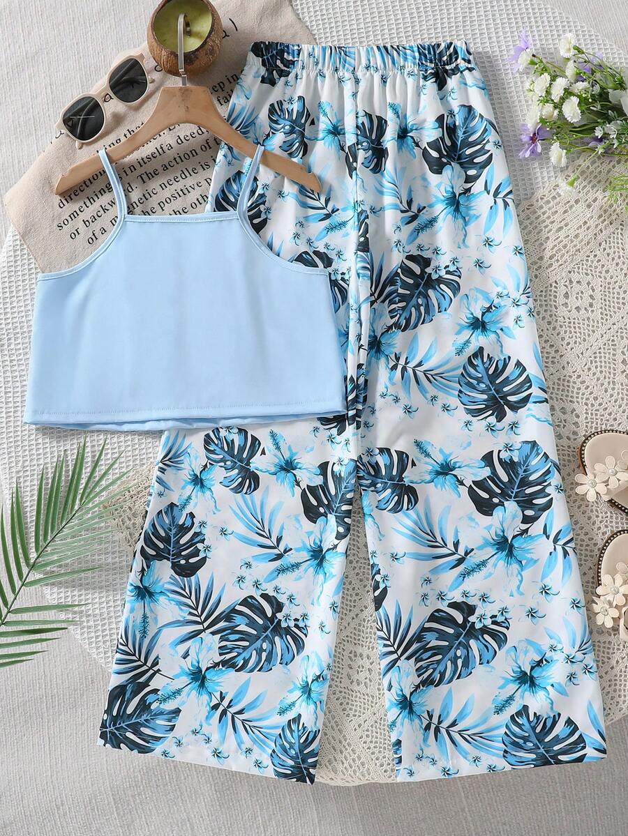 Tween girls blue 2-piece vacation outfit set featuring a tiered ruffle spaghetti strap camisole and loose high-waist pants.