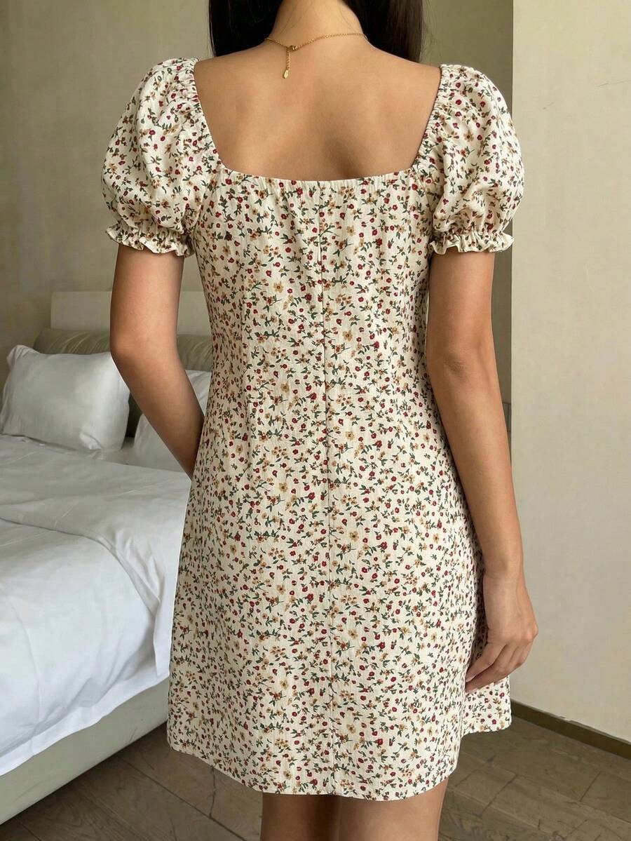 Black floral all-over print midi dress for tween girls featuring puff half sleeves, spaghetti strap neckline, and an A-line silhouette.