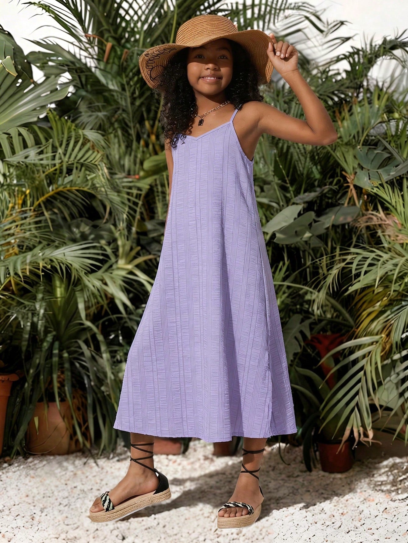 tween girls multicolor all-over printed spaghetti strap boho cami dress with sleeveless design, natural waist, flared hem, and long slim fit silhouette.