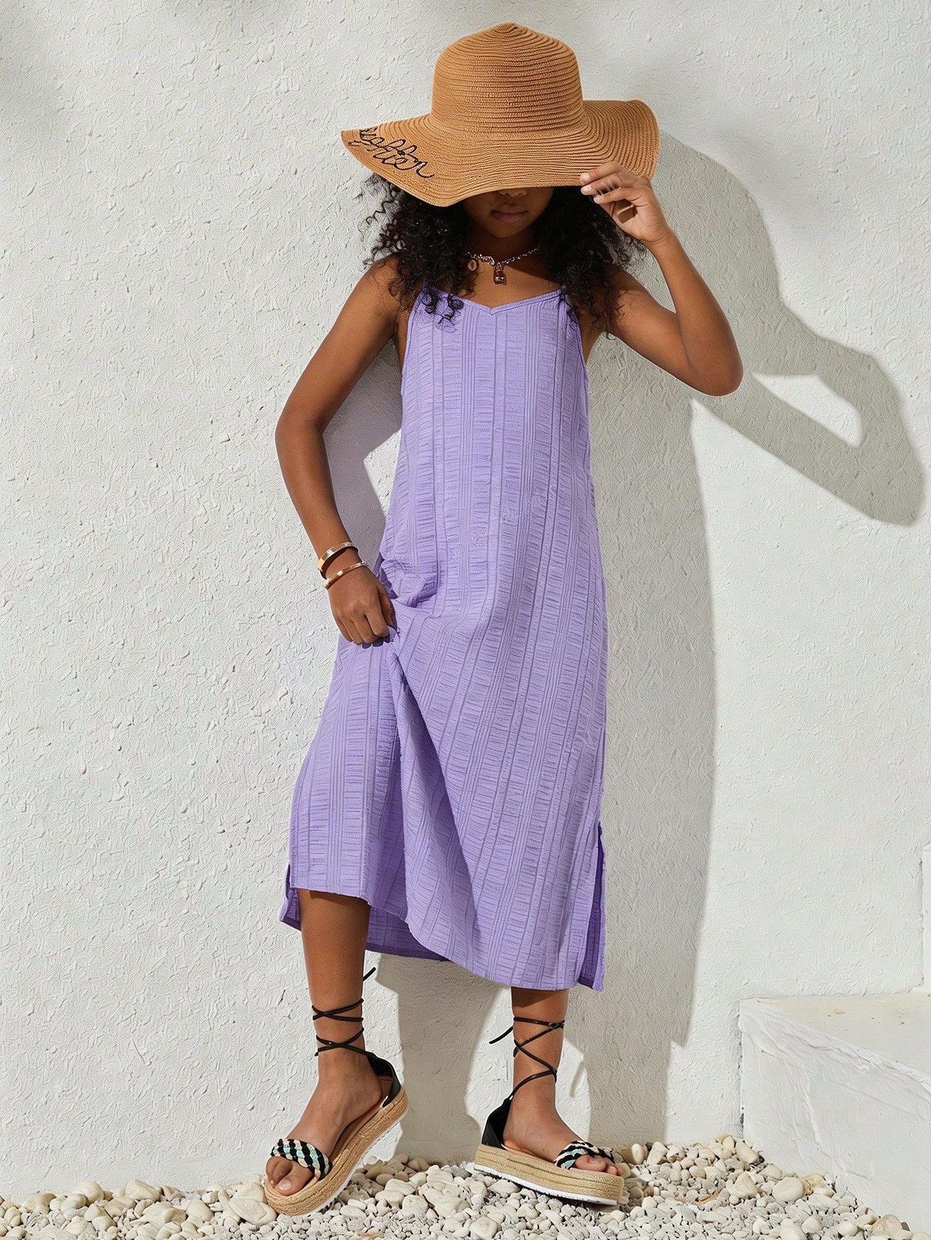 tween girls multicolor all-over printed spaghetti strap boho cami dress with sleeveless design, natural waist, flared hem, and long slim fit silhouette.