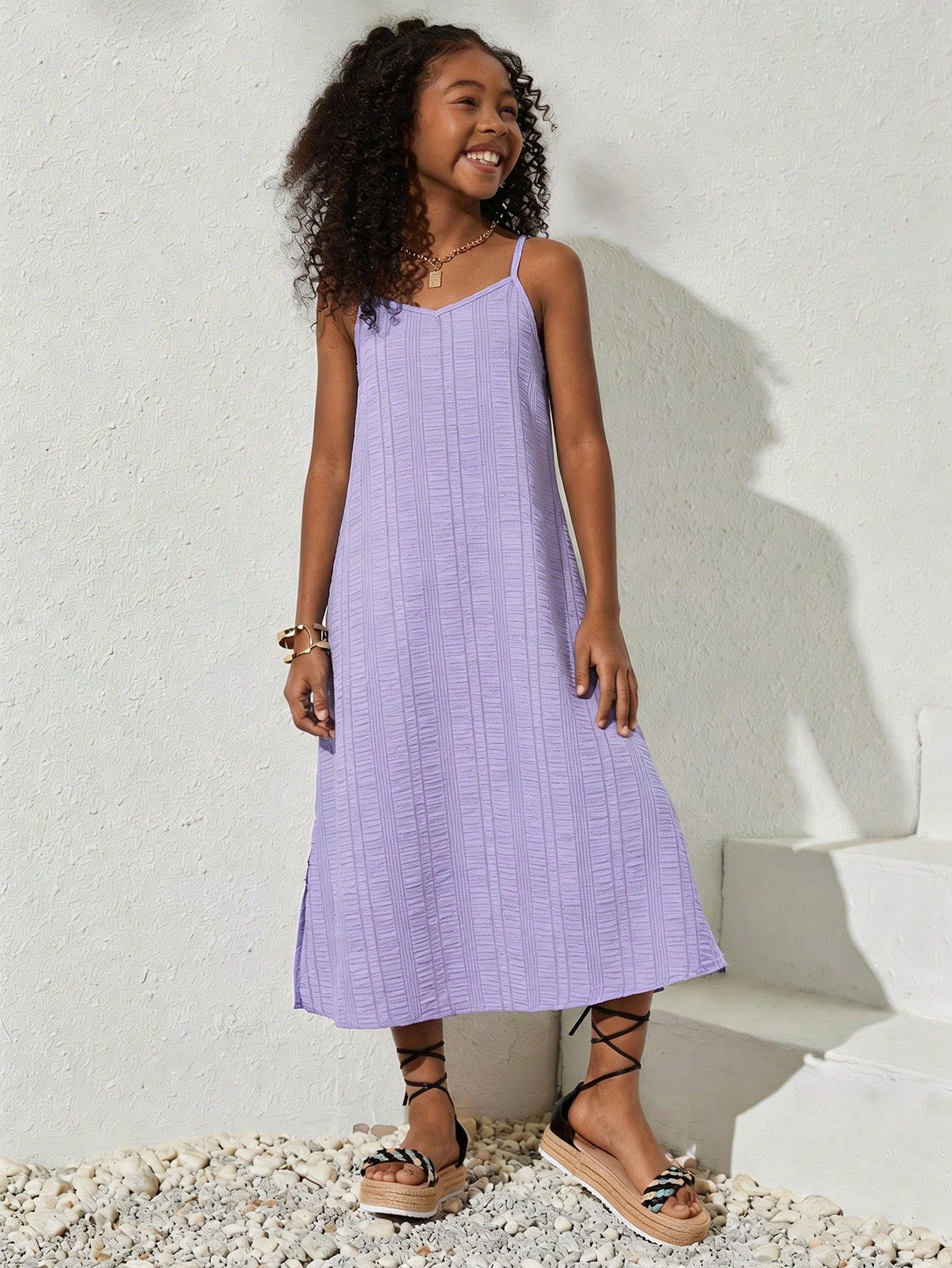 tween girls multicolor all-over printed spaghetti strap boho cami dress with sleeveless design, natural waist, flared hem, and long slim fit silhouette.