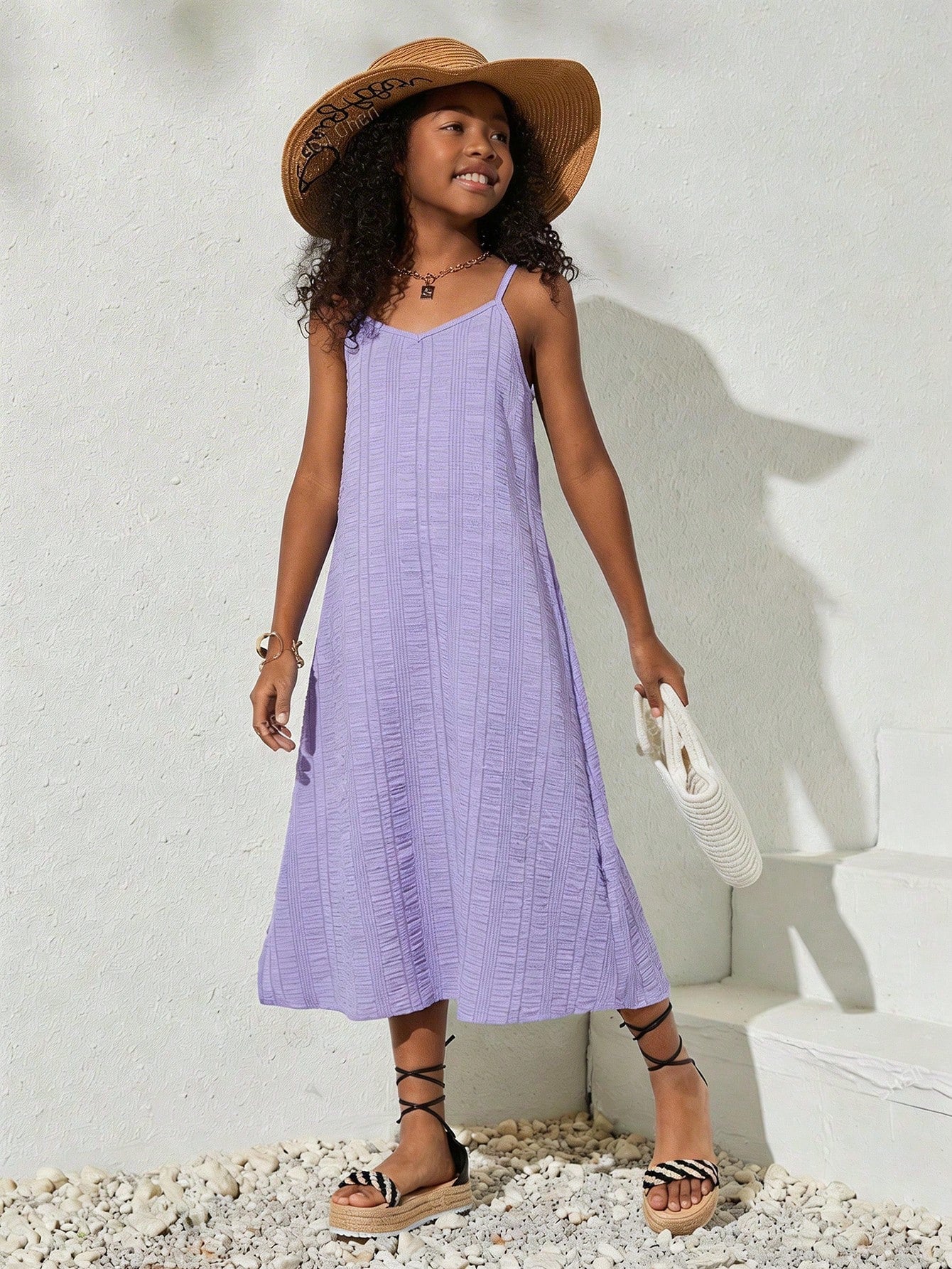 tween girls multicolor all-over printed spaghetti strap boho cami dress with sleeveless design, natural waist, flared hem, and long slim fit silhouette.
