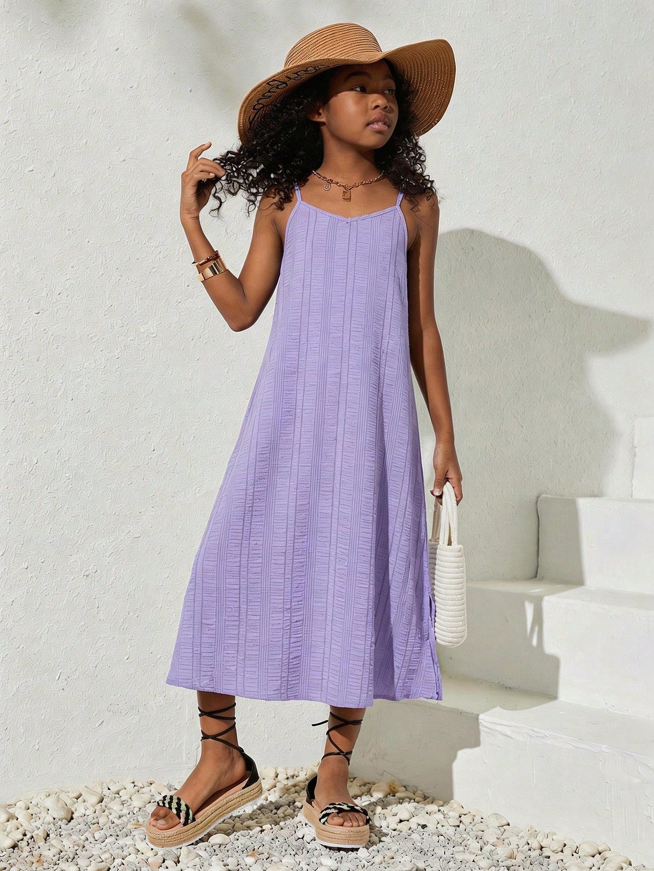 tween girls multicolor all-over printed spaghetti strap boho cami dress with sleeveless design, natural waist, flared hem, and long slim fit silhouette.