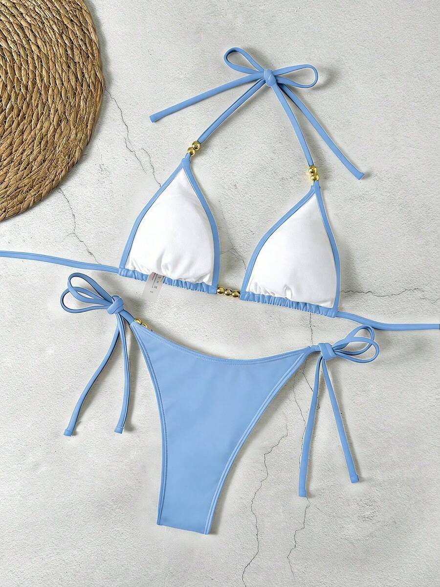 Women's black halter bikini set featuring triangle cups with gold bead decor and tie-back closure