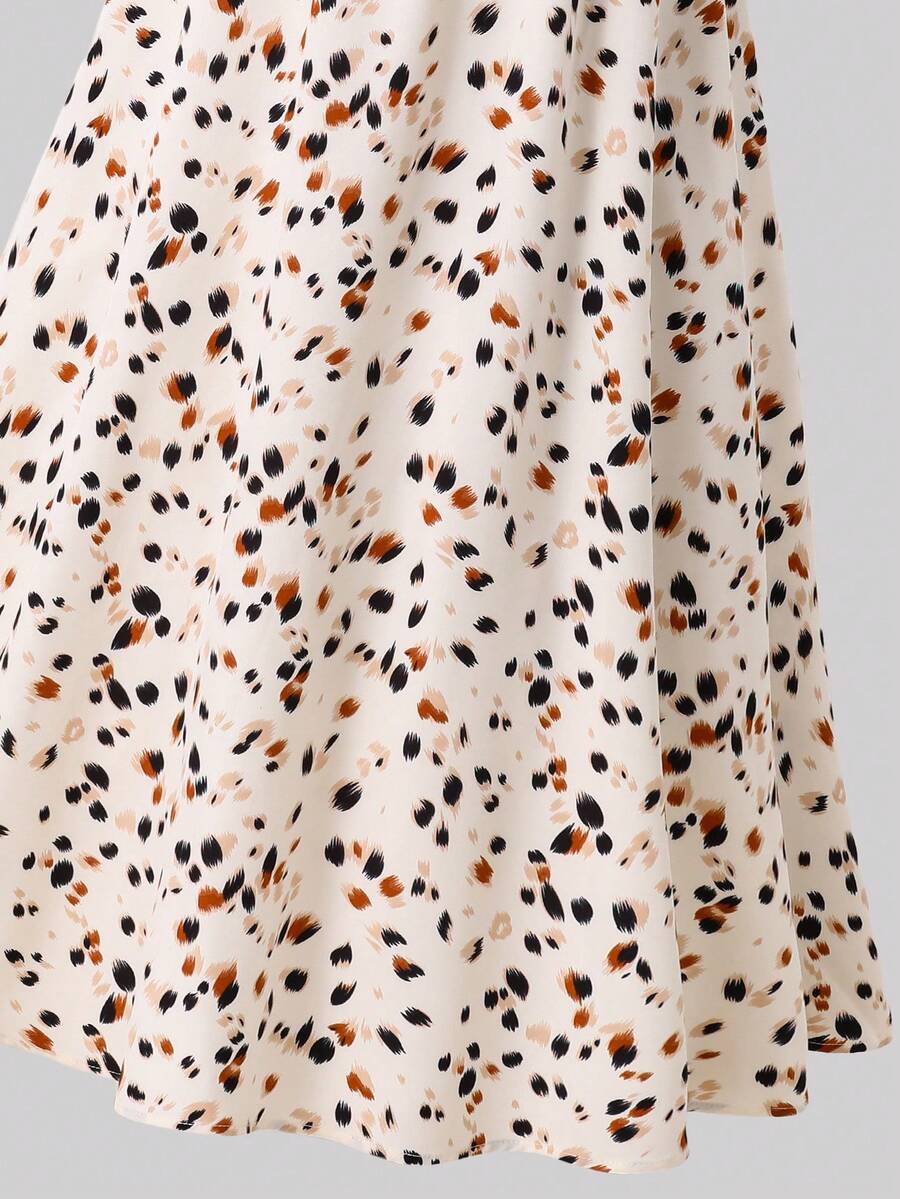 Tween girl wearing an apricot plant print sleeveless A-line long dress with a round neckline and flared skirt.