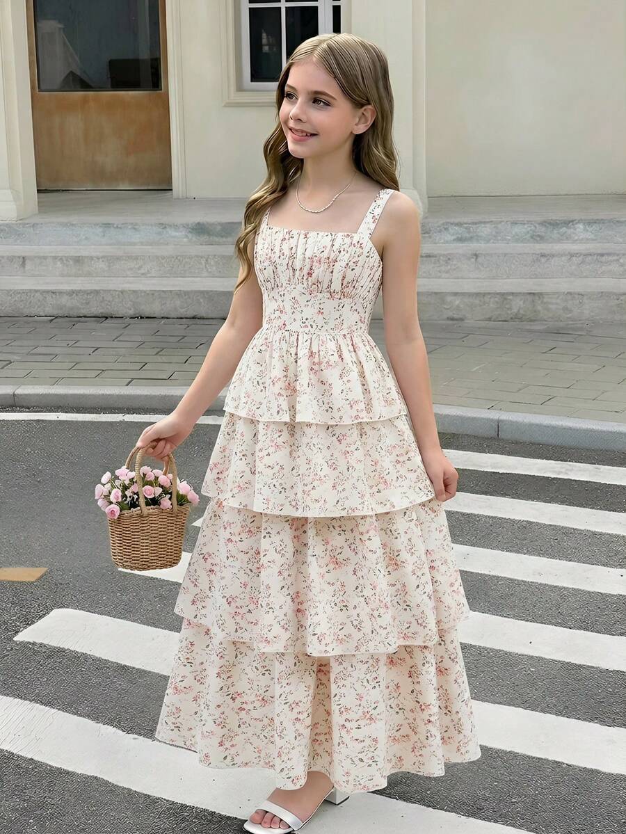 Tween girls blue ditsy floral sleeveless long dress with spaghetti straps, ruched bust, high waist, and tiered layered hem.