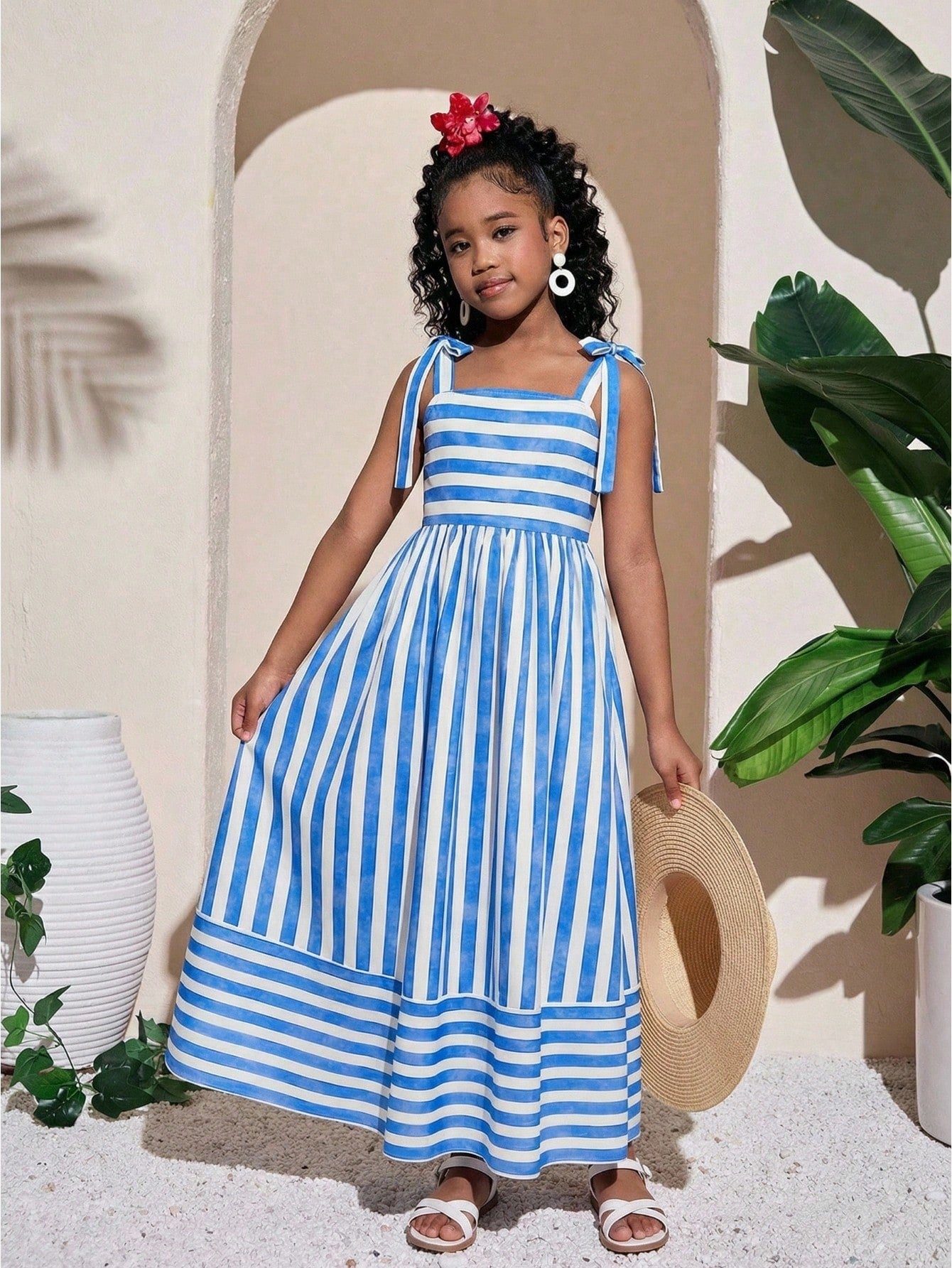 Tween girls striped spaghetti strap cami dress with high waist, shirred detail, zipper closure, sleeveless design, and flared long A-line silhouette for vacation wear.