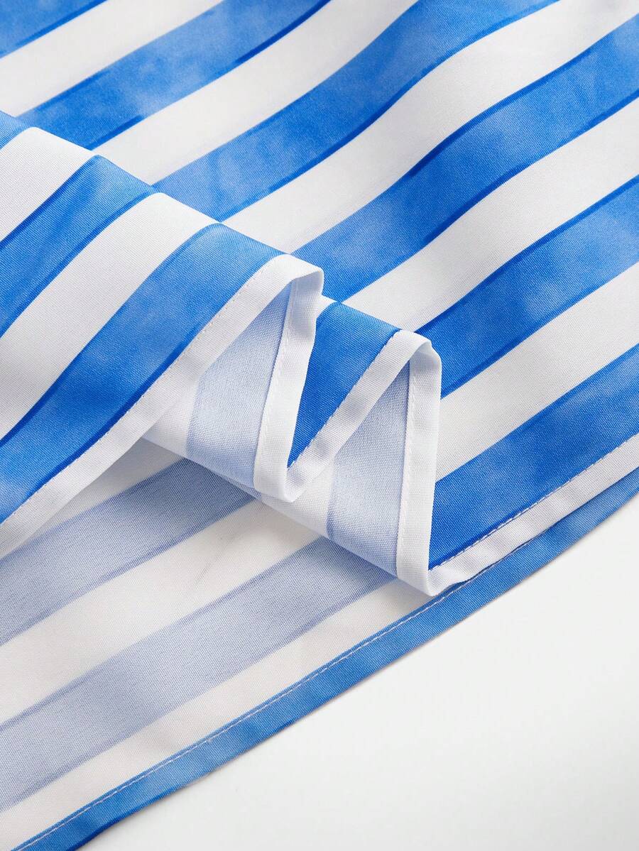 Tween girls blue striped summer camisole dress featuring spaghetti straps, high waist, flared hem, and back zipper detail.