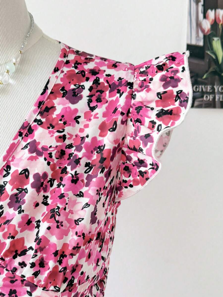 Tween girl wearing a black ditsy floral A-line short dress with V-neckline and flounce short sleeves.