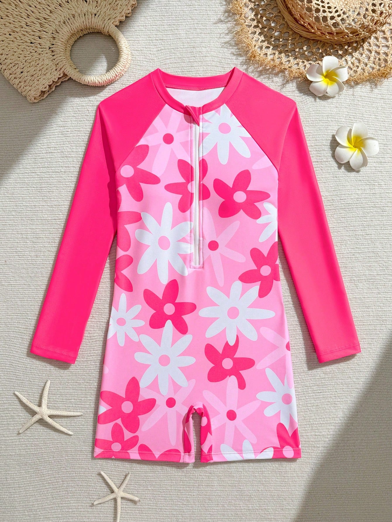 Tween girls one-piece swimsuit featuring a high neck, long sleeves, and shorts bottom, with a back zipper and strawberry plaid digital print on stretch knit fabric. Designed for swimming, vacation, and summer wear.