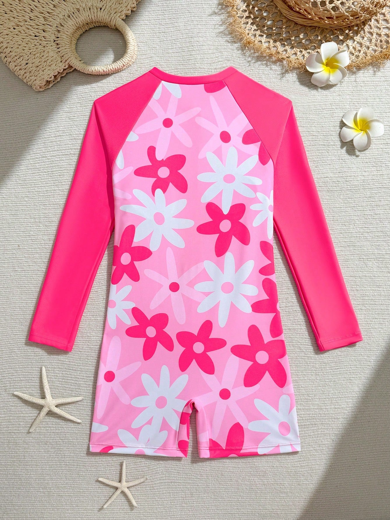 Tween girls one-piece swimsuit featuring a high neck, long sleeves, and shorts bottom, with a back zipper and strawberry plaid digital print on stretch knit fabric. Designed for swimming, vacation, and summer wear.