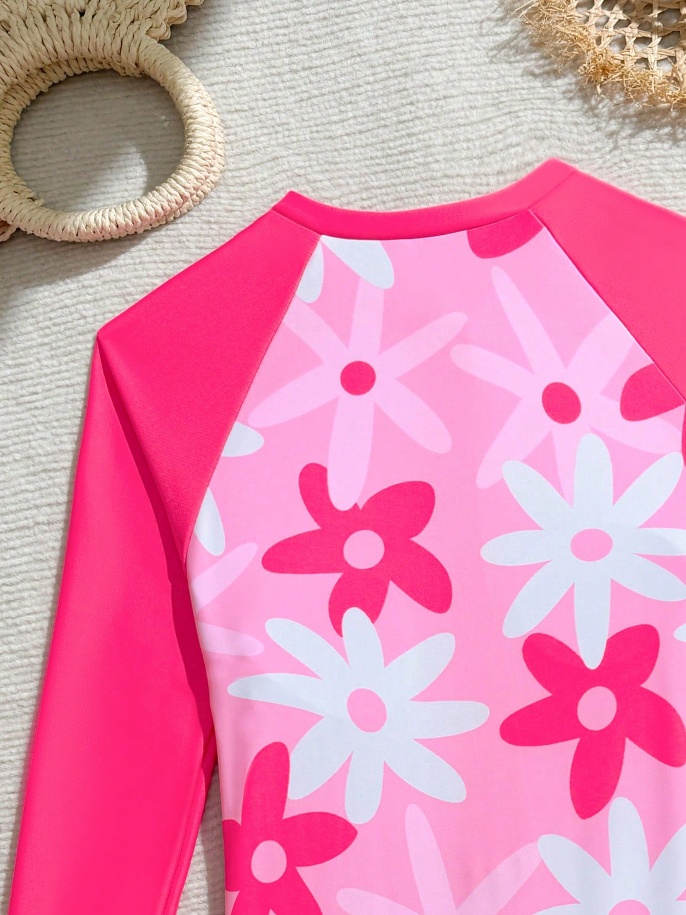 Tween girls one-piece swimsuit featuring a high neck, long sleeves, and shorts bottom, with a back zipper and strawberry plaid digital print on stretch knit fabric. Designed for swimming, vacation, and summer wear.