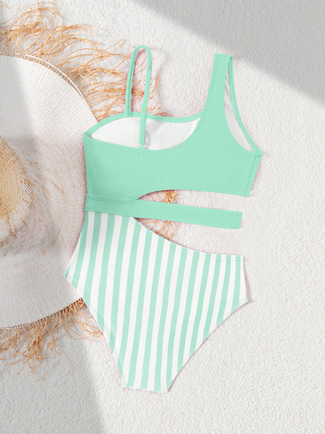 Purple tween girls one-piece swimsuit with asymmetrical neckline, cut-out waist, striped pattern, fitted silhouette, and lined body.