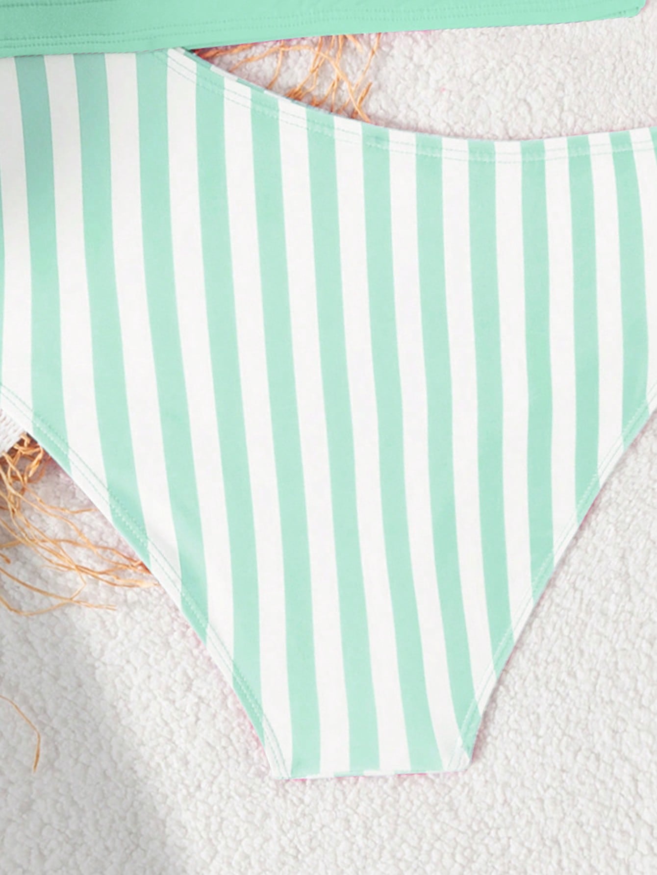 Purple tween girls one-piece swimsuit with asymmetrical neckline, cut-out waist, striped pattern, fitted silhouette, and lined body.