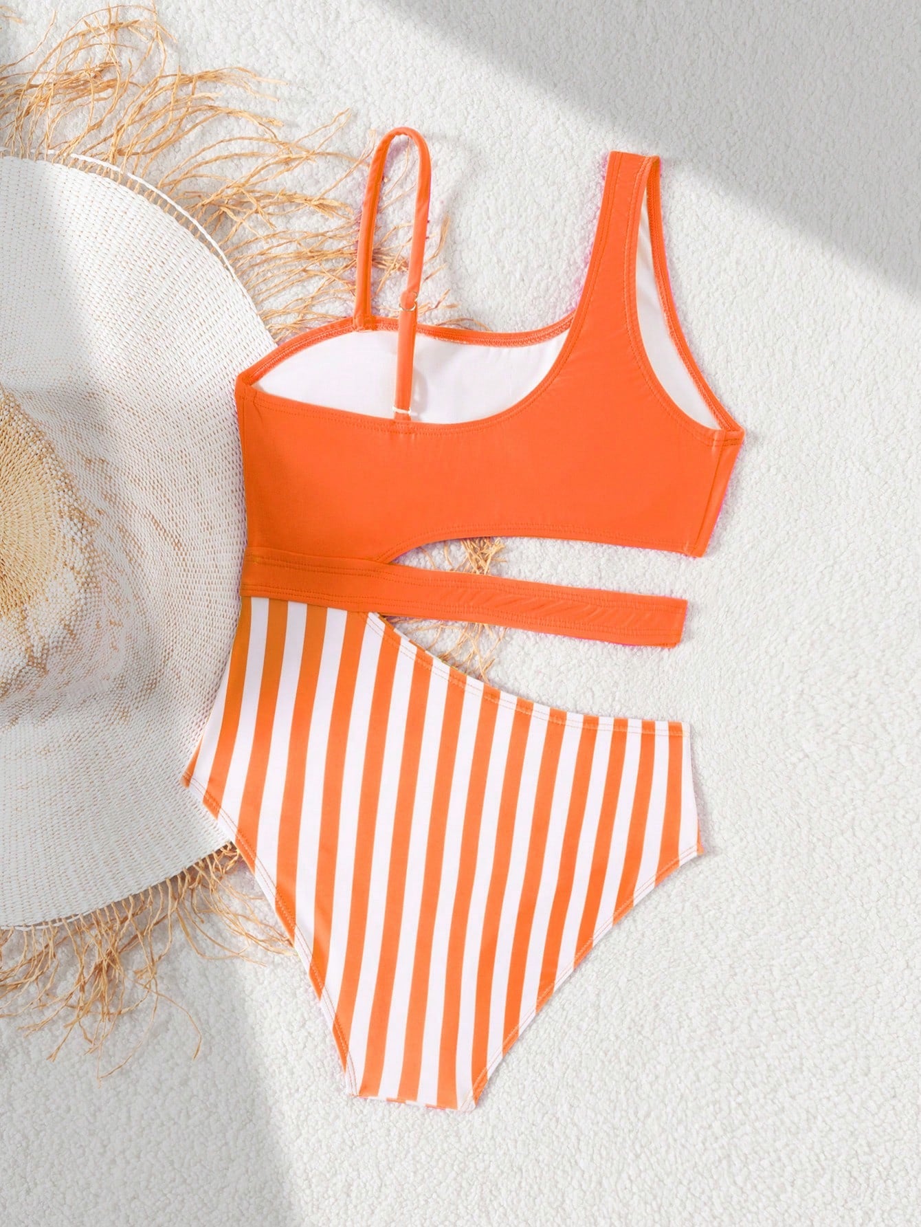 Purple tween girls one-piece swimsuit with asymmetrical neckline, cut-out waist, striped pattern, fitted silhouette, and lined body.