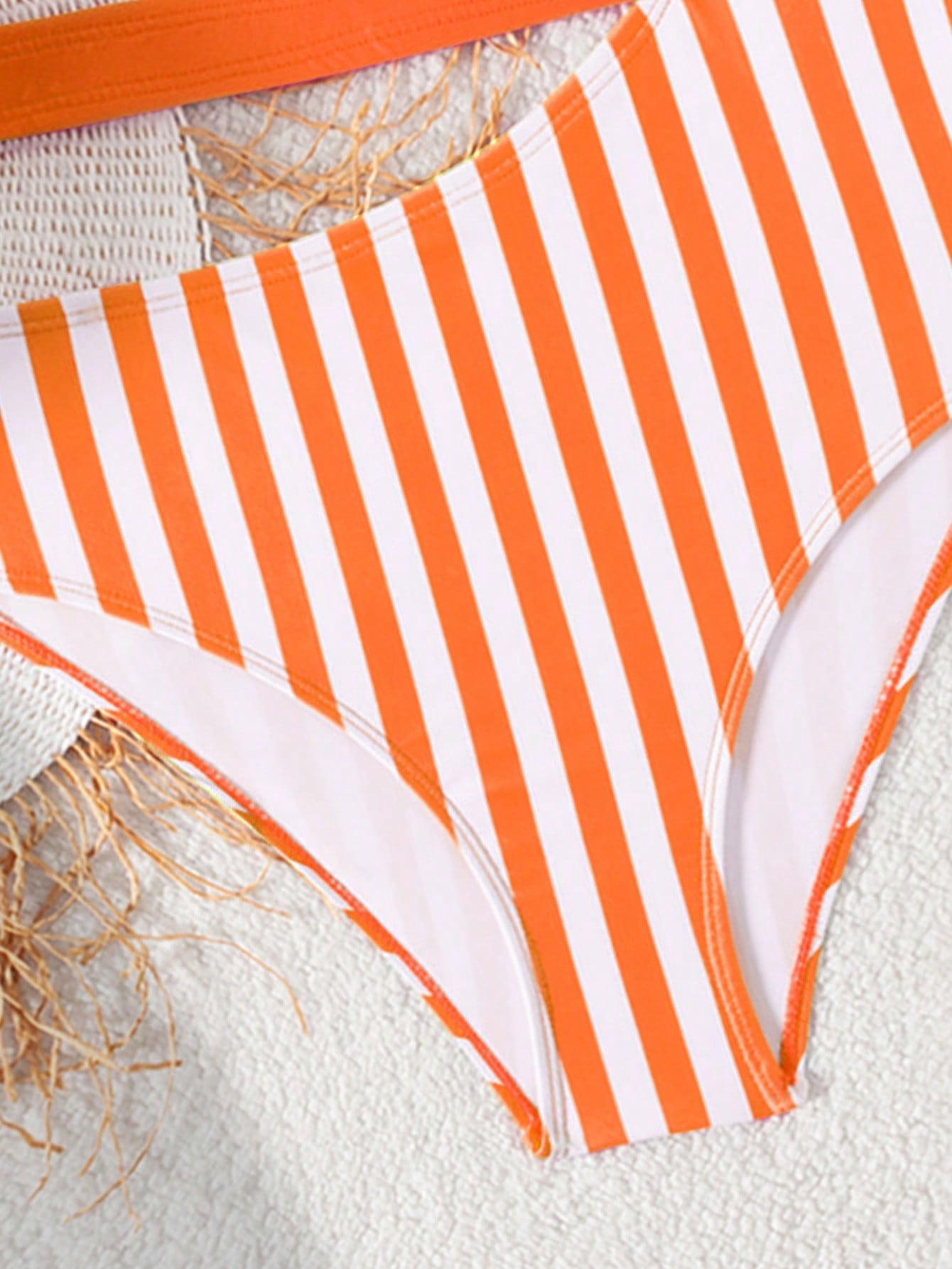 Purple tween girls one-piece swimsuit with asymmetrical neckline, cut-out waist, striped pattern, fitted silhouette, and lined body.