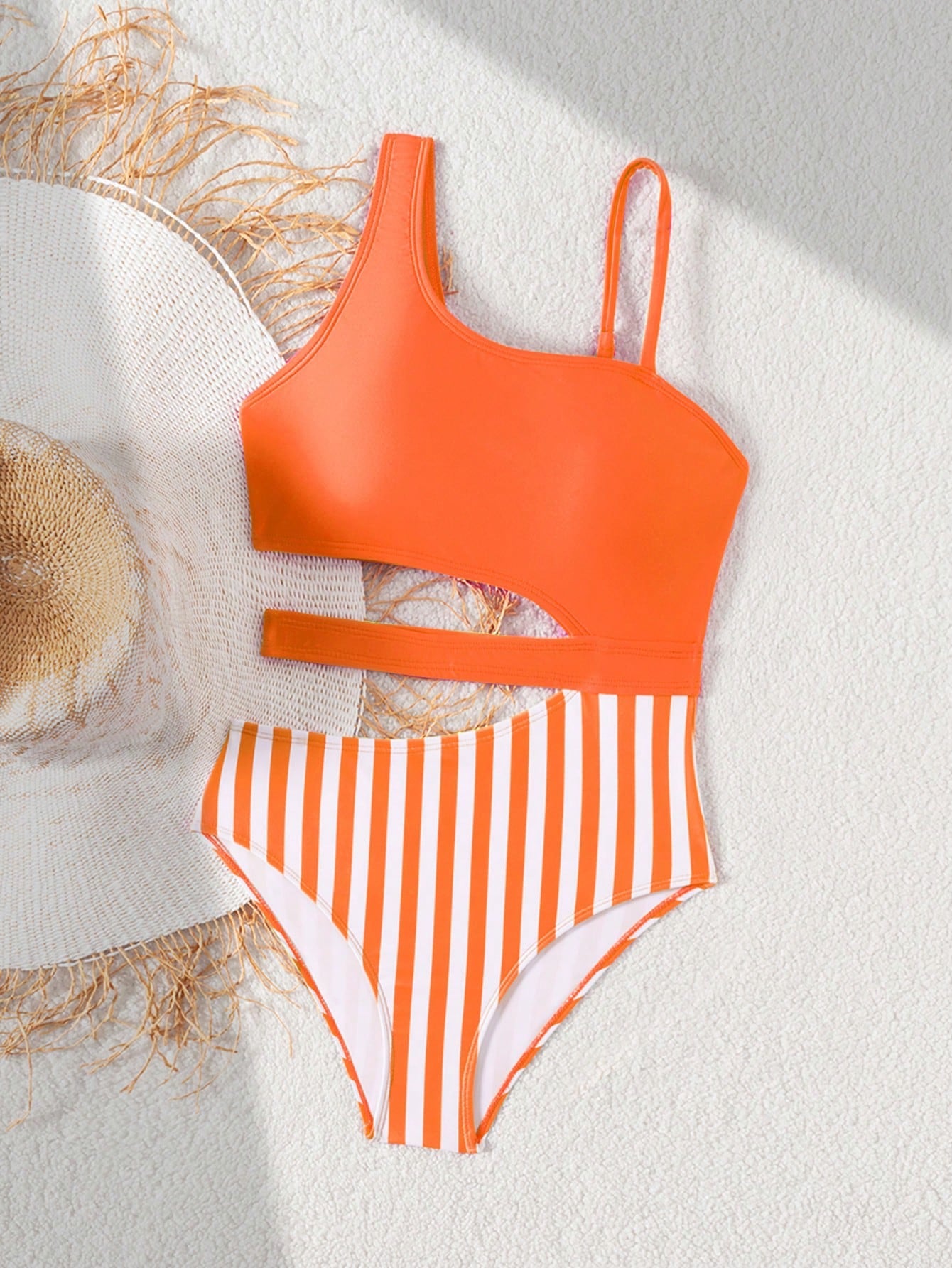 Purple tween girls one-piece swimsuit with asymmetrical neckline, cut-out waist, striped pattern, fitted silhouette, and lined body.