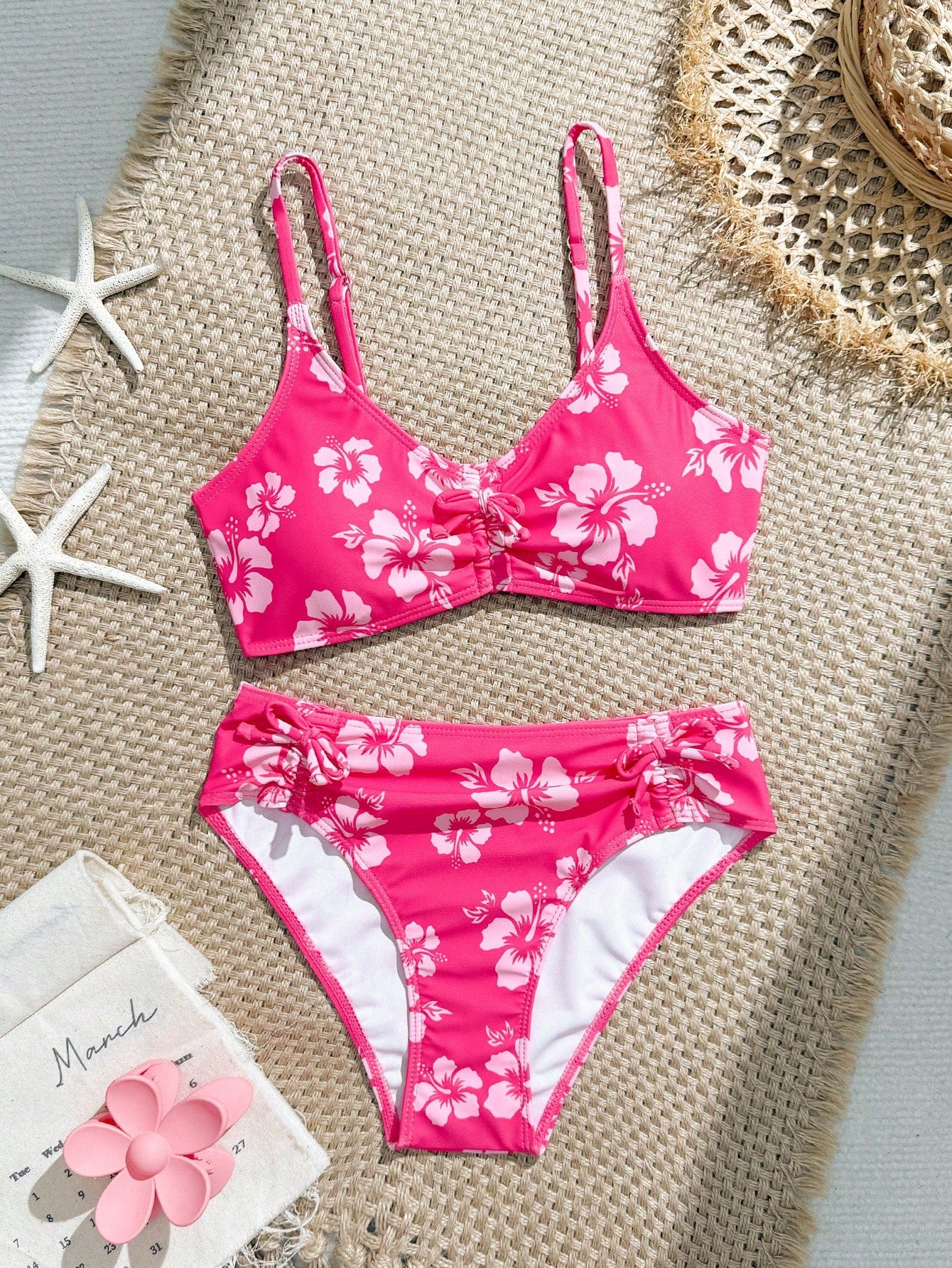 Tween girls 2-piece ditsy floral bikini set featuring a spaghetti strap top with center string detail and matching bottoms with side strings, designed for swimming, vacation, and summer wear.