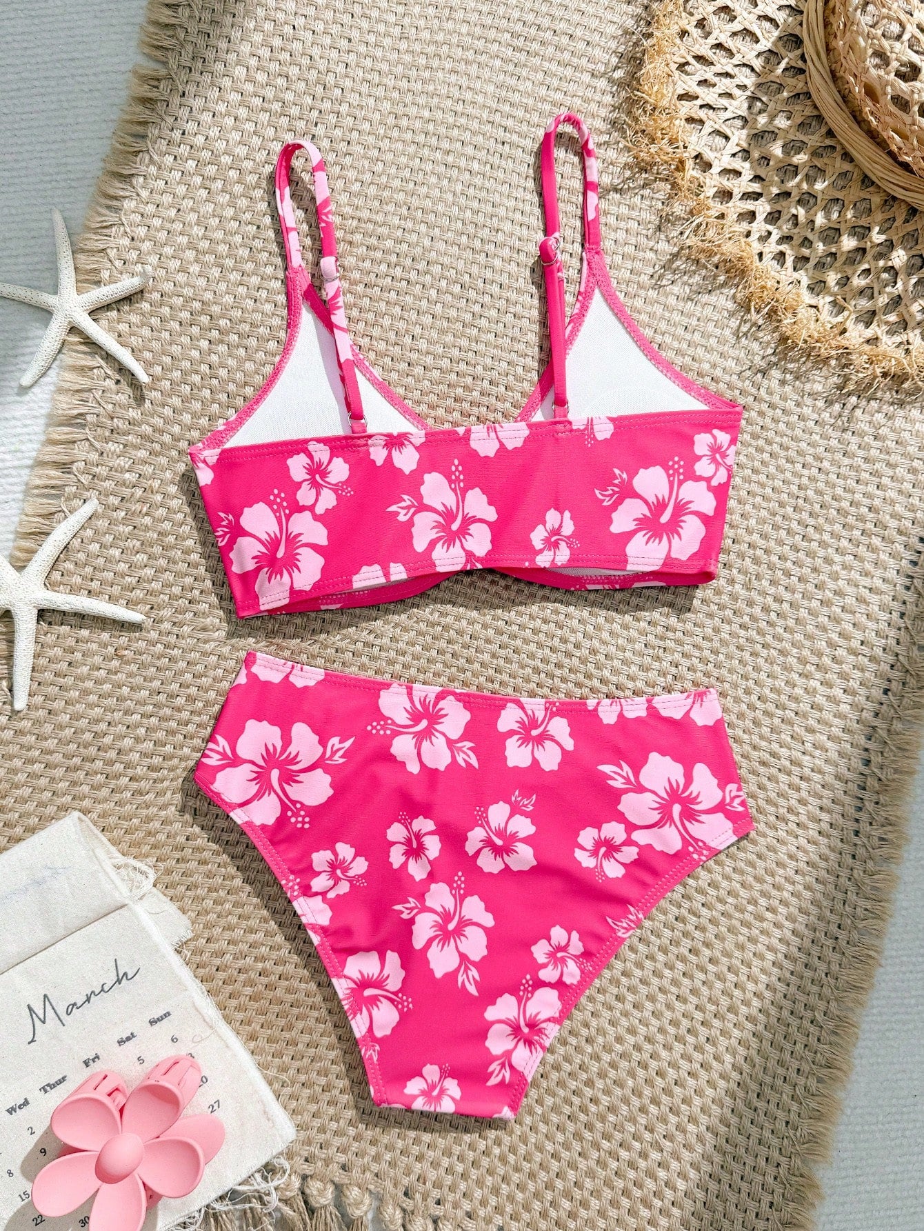 Tween girls 2-piece ditsy floral bikini set featuring a spaghetti strap top with center string detail and matching bottoms with side strings, designed for swimming, vacation, and summer wear.